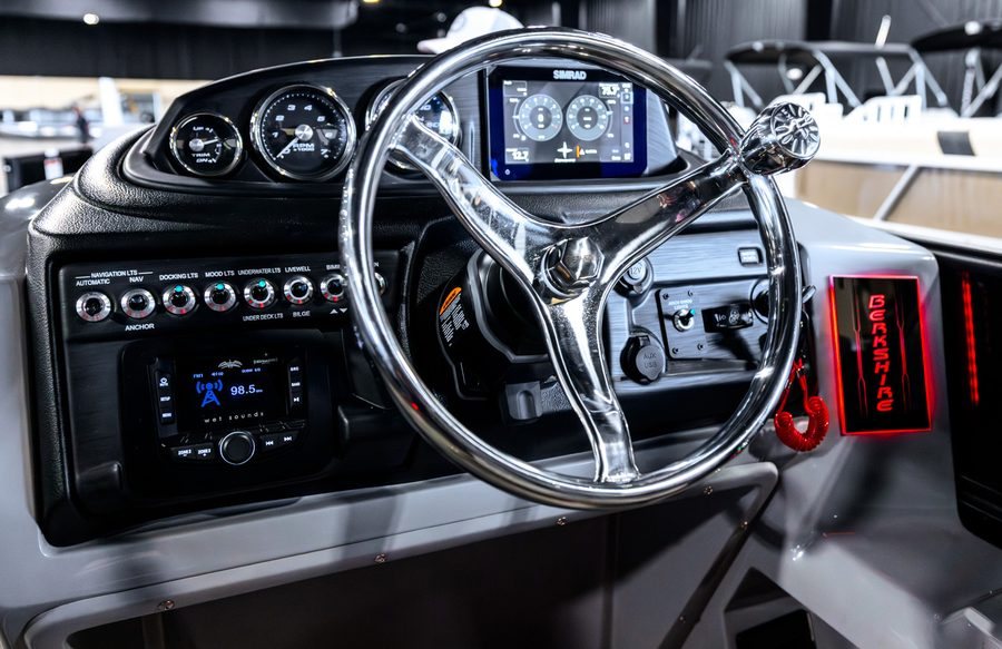 Berkshire pontoon helm with gauges, steering wheel, controls, and display