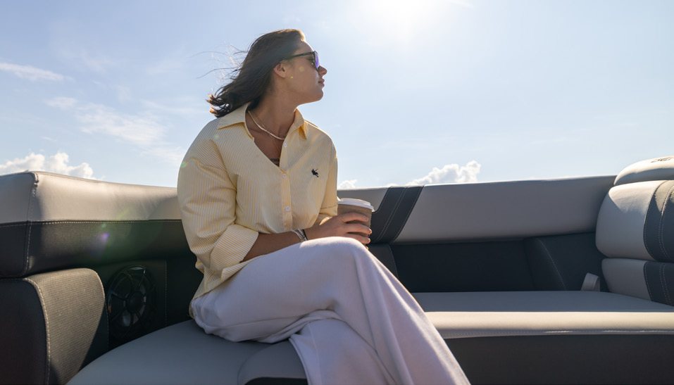 Berkshire pontoon lounge seating with passenger relaxing onboard