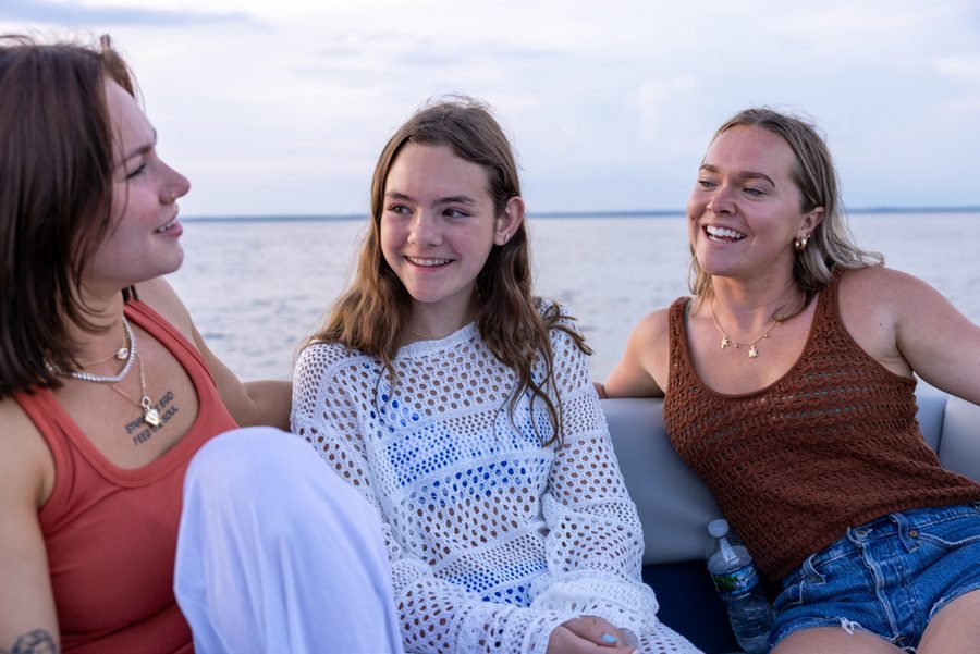 Family seated aboard a Dockside pontoon