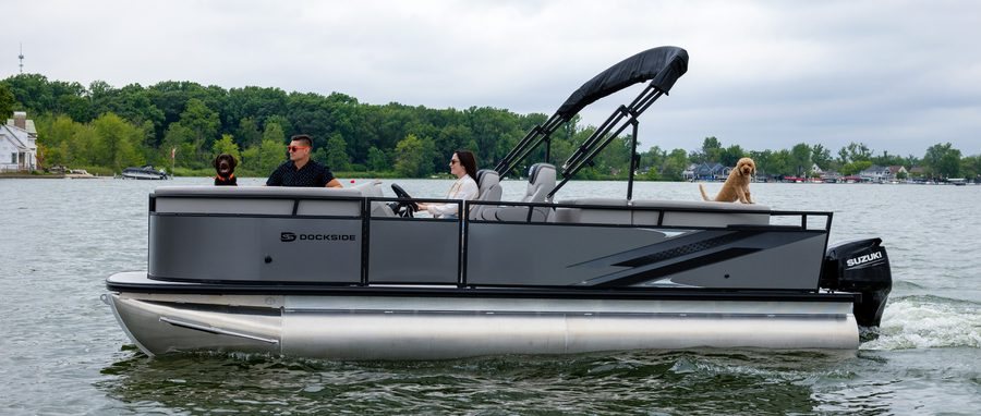 Dockside pontoon running on the lake with passengers aboard