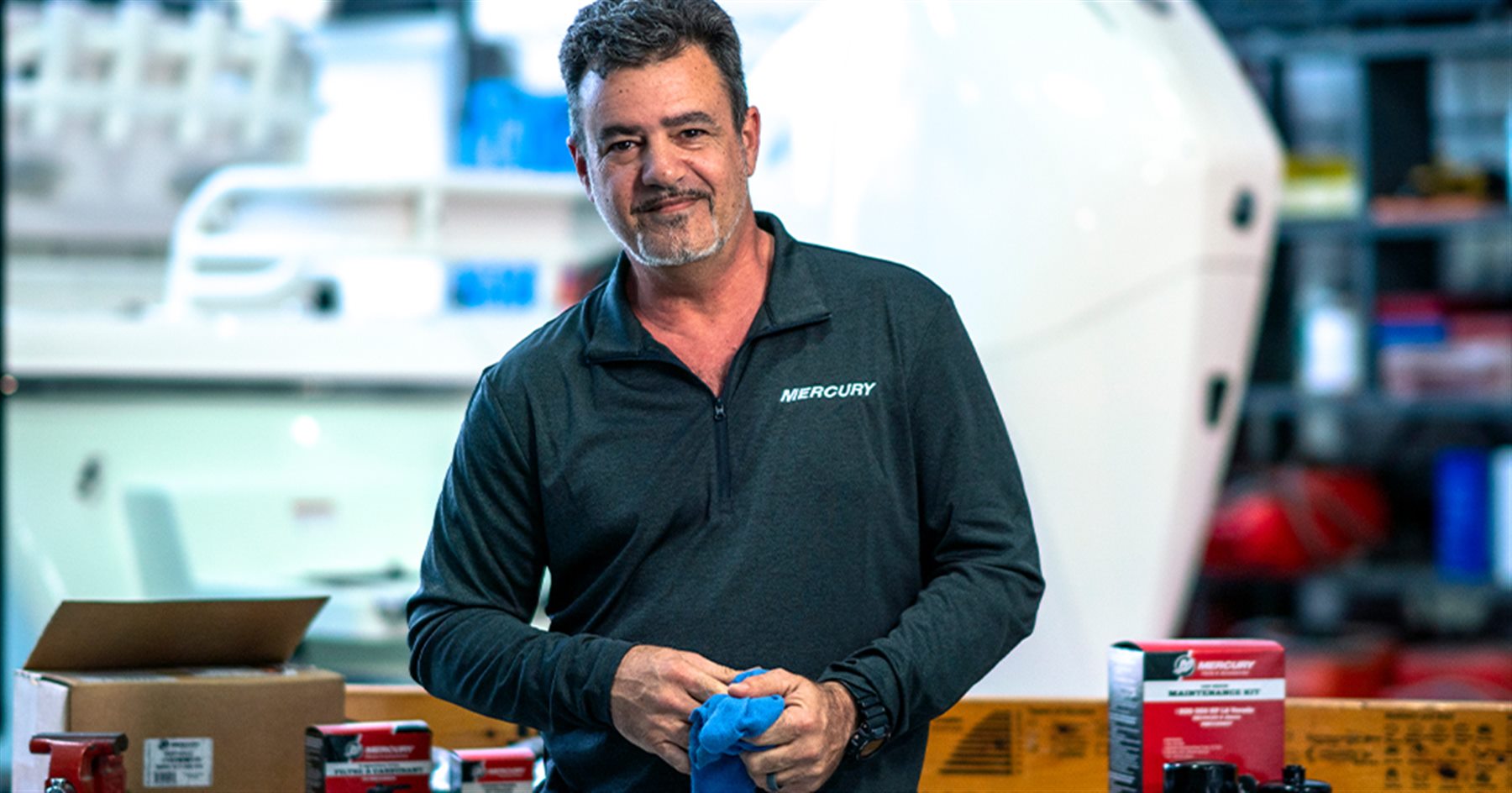 Mercury service technician in a marine shop